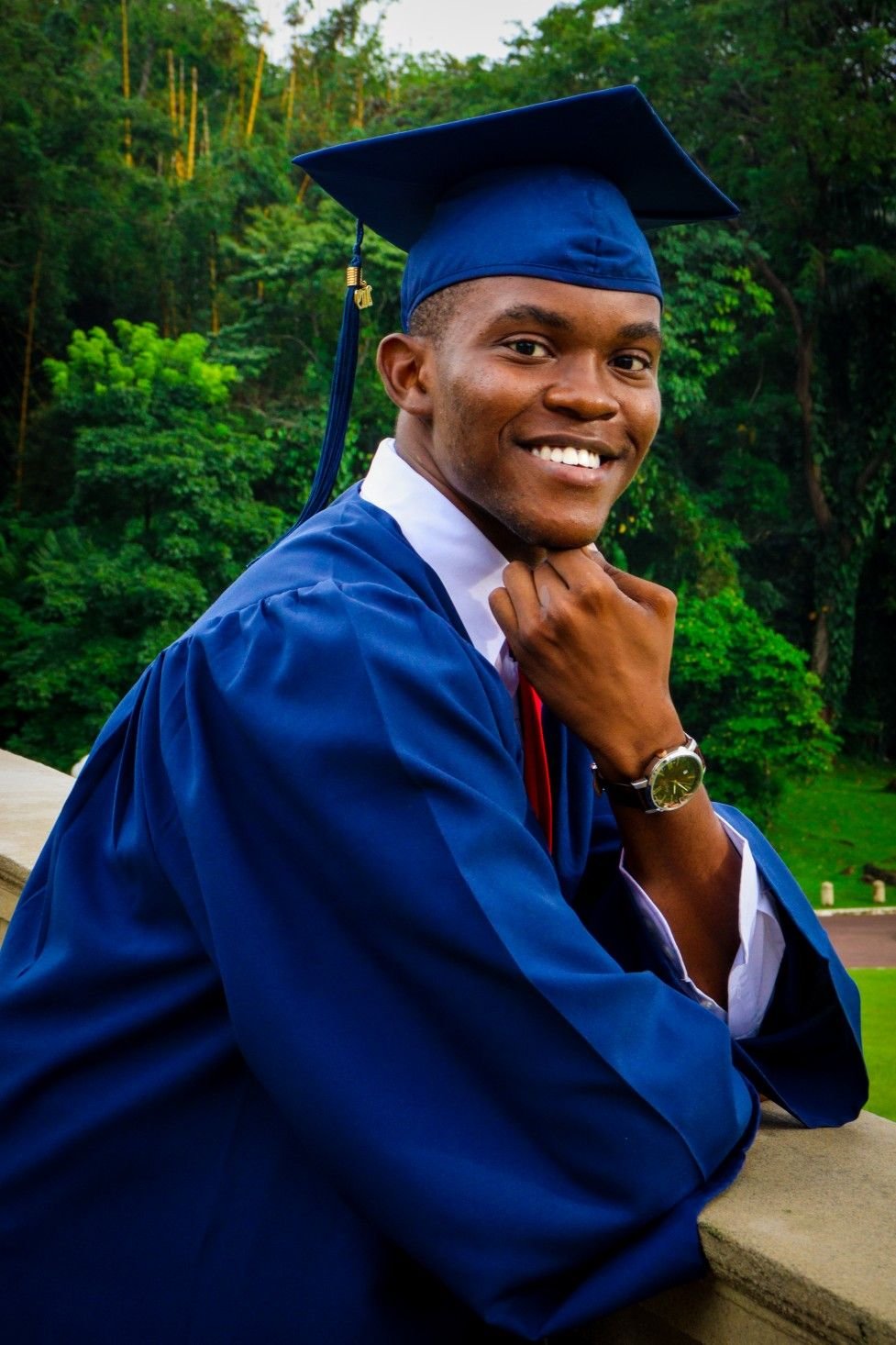 Mvungi graduate in a blue gown